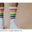 A man in socks with stripes in the colour of the rainbow