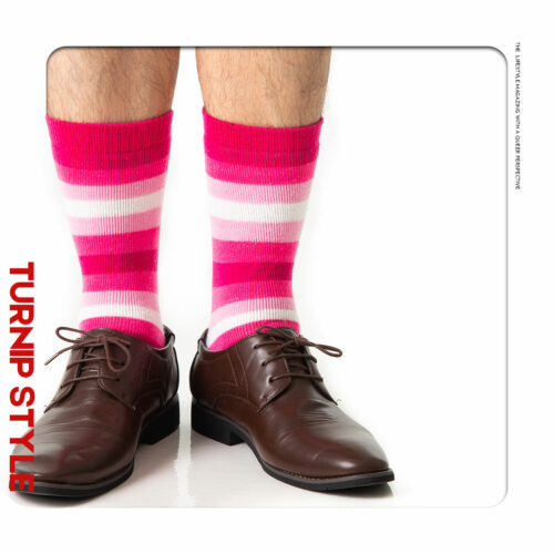 A man in pink striped socks and loafers