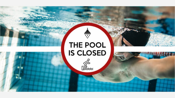 Underwater view of man swimming laps in an olympic pool