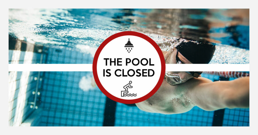 Underwater view of man swimming laps in an olympic pool