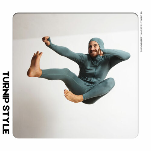 Man jumping through the air in head to toe long underwear
