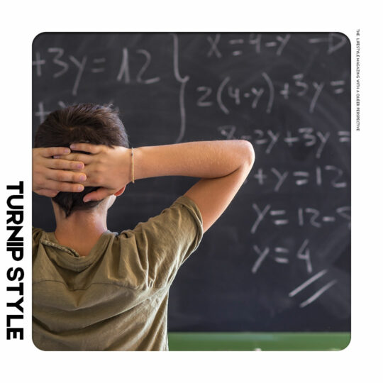 Student solving math problems on a chalk board