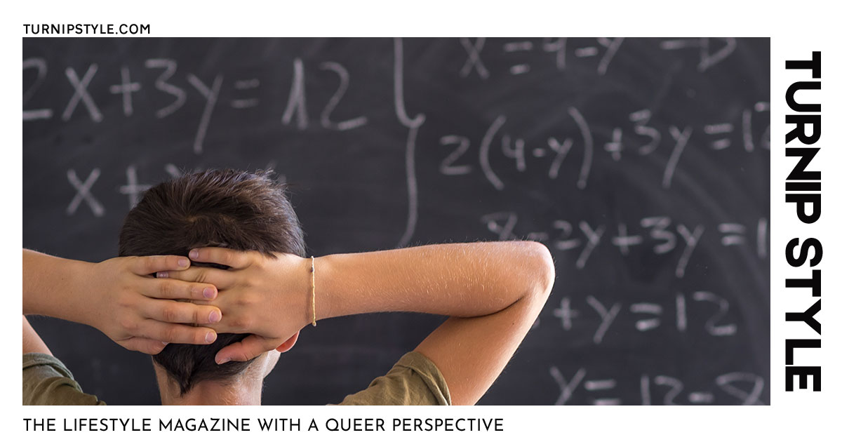 Student solving math problems on a chalk board